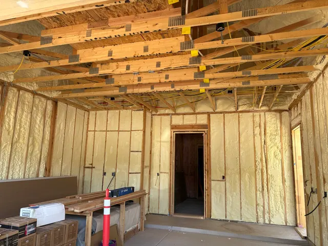 Ceiling and wall wiring before drywall.