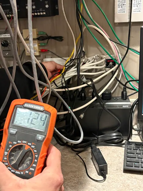 Checking power at an equipment connection.