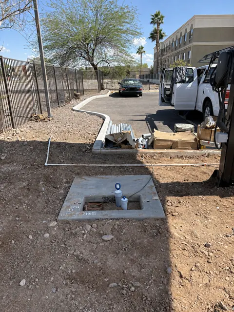 Conduit and equipment-pad preparation for an EV charging installation.