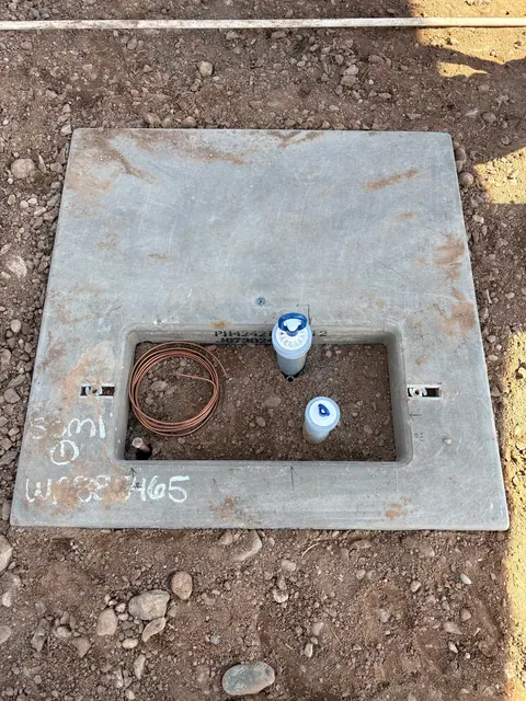 Equipment pad with conduit stub-ups and grounding wire.