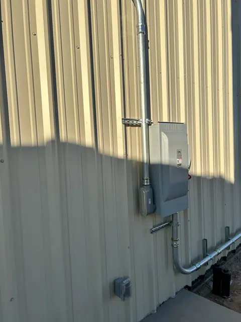 Exterior disconnect with supported conduit runs.