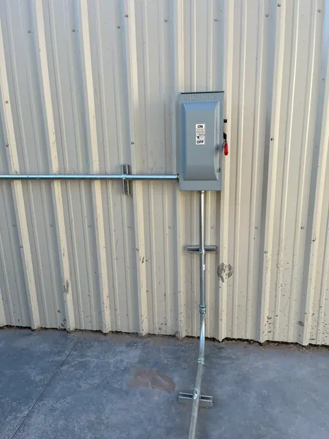 Exterior equipment disconnect with secured conduit runs.