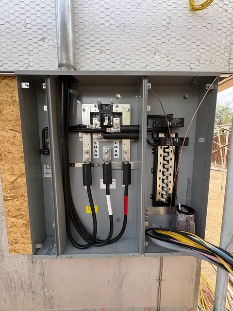 Meter-main panel and service wiring during construction.