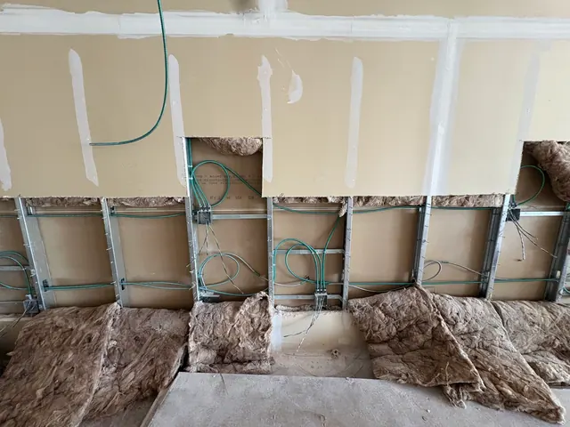 New outlet and switch wiring inside a commercial wall.