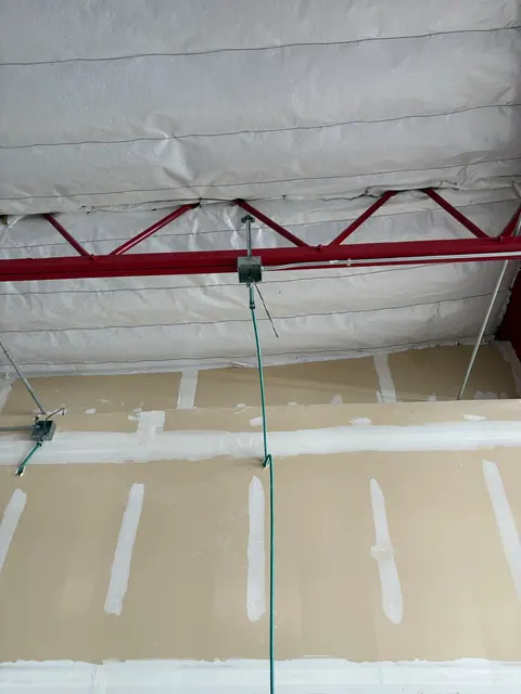 Overhead junction boxes and circuit drops during a tenant build-out.
