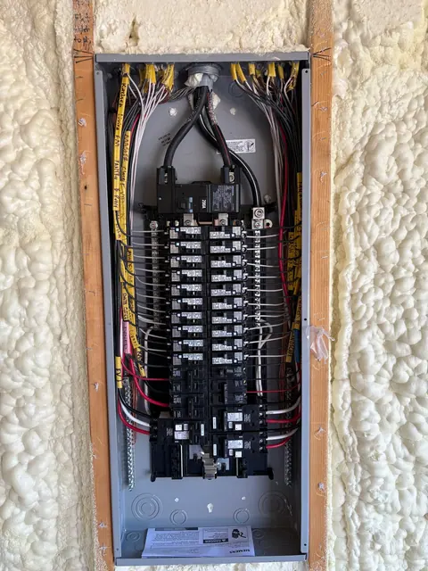 Residential panel wiring with labeled branch circuits.