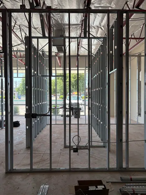 Tenant-space circuit rough-in across new interior walls.