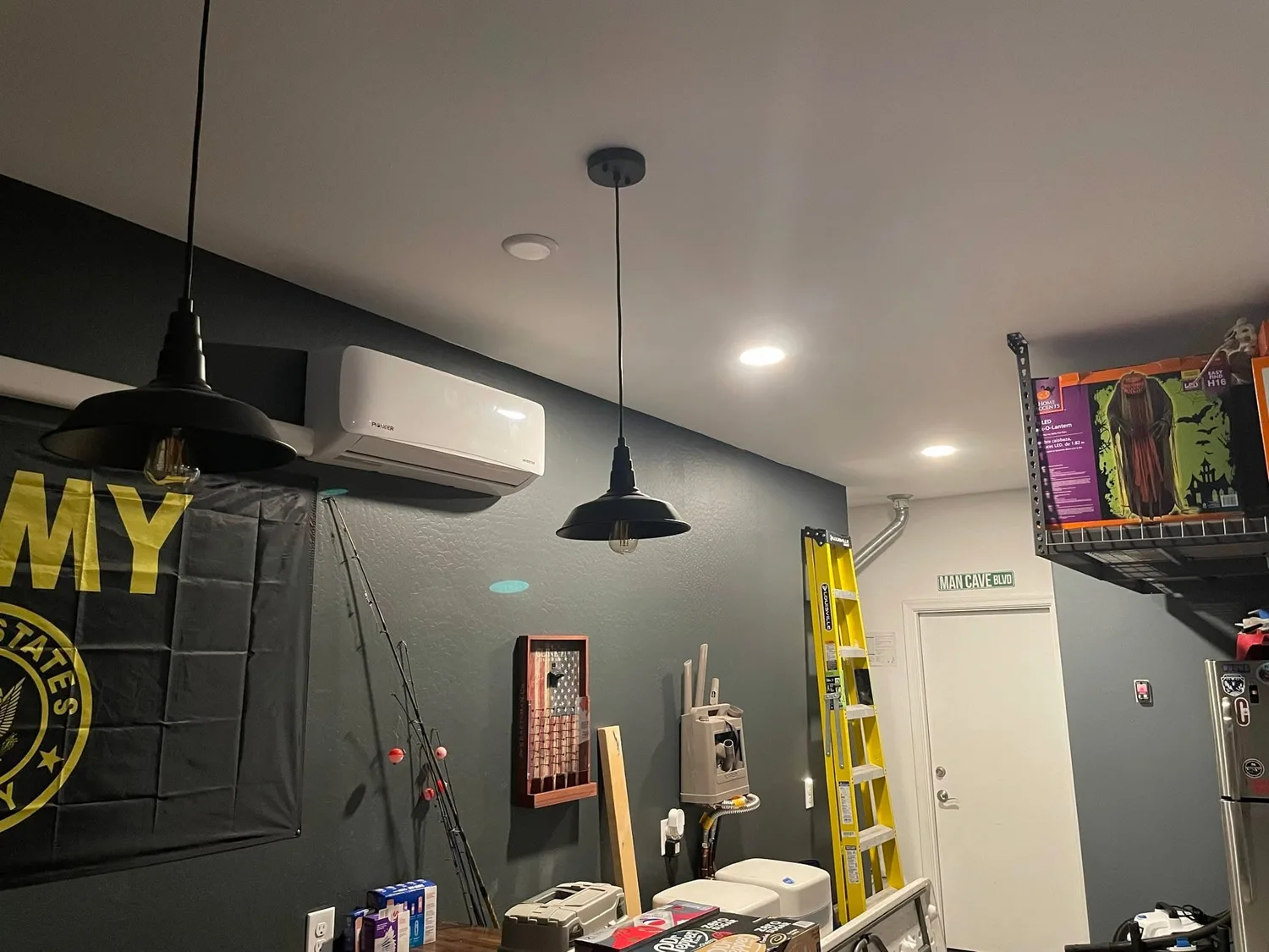 Garage workshop with a mini split, pendants and recessed lighting on new circuits by Gray Electric
