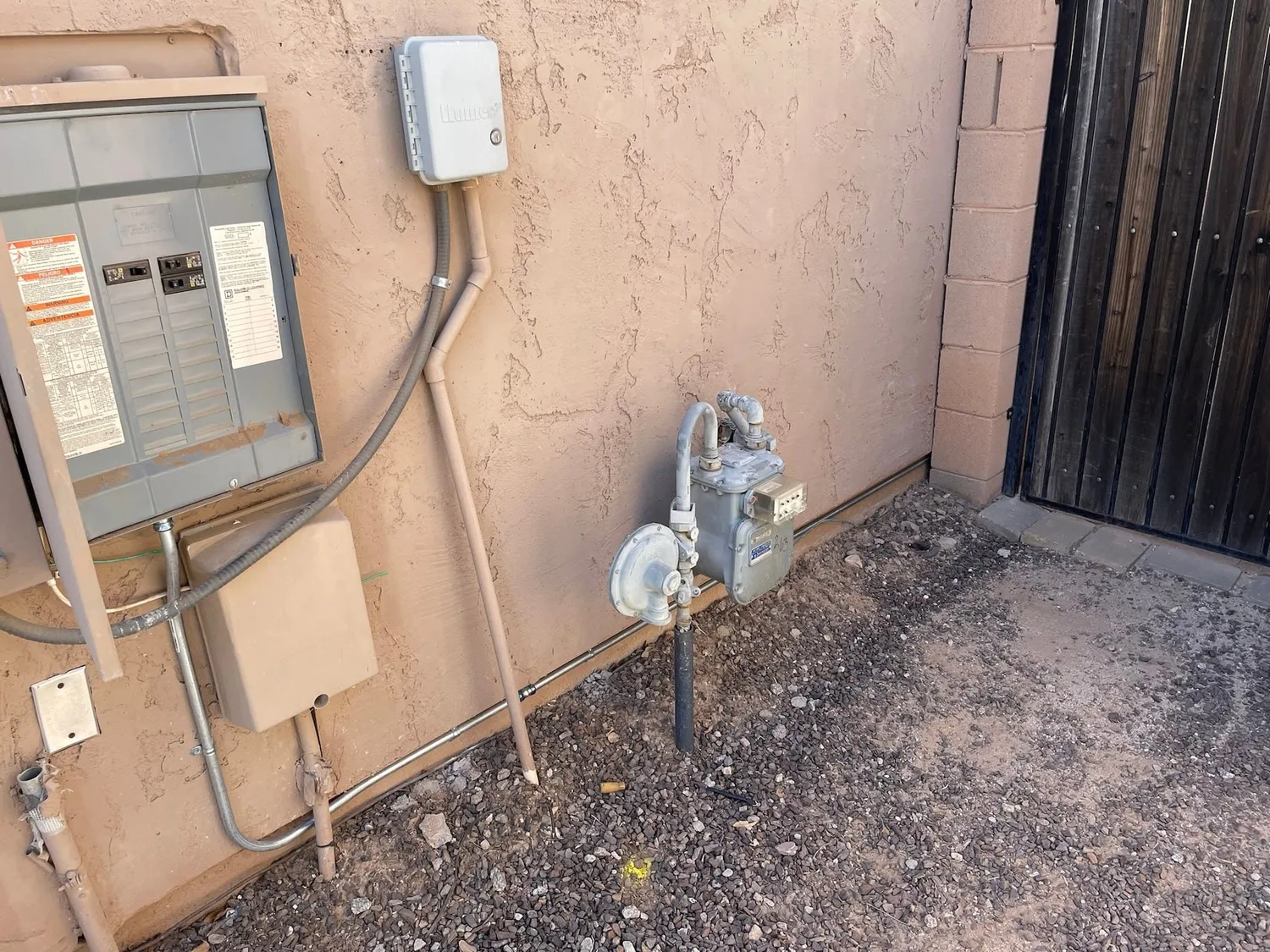 Gray Electric electrician inspecting a home electrical system